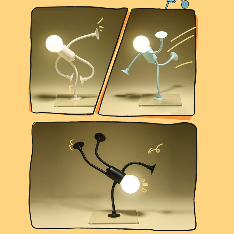 Drie lichtgevende lampjes in een stripachtig kader: wit, lichtblauw en zwart, elk in een andere dynamische pose op een glazen plaatje. 1