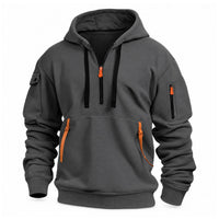 Donkergrijze hoodie met halve rits, zwarte trekkoorden en oranje bandjes aan de kangoeroezak, vooraanzicht 6