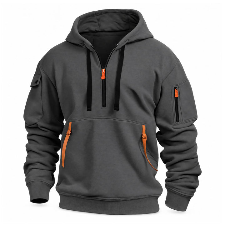 Donkergrijze hoodie met halve rits, zwarte trekkoorden en oranje bandjes aan de kangoeroezak, vooraanzicht 6