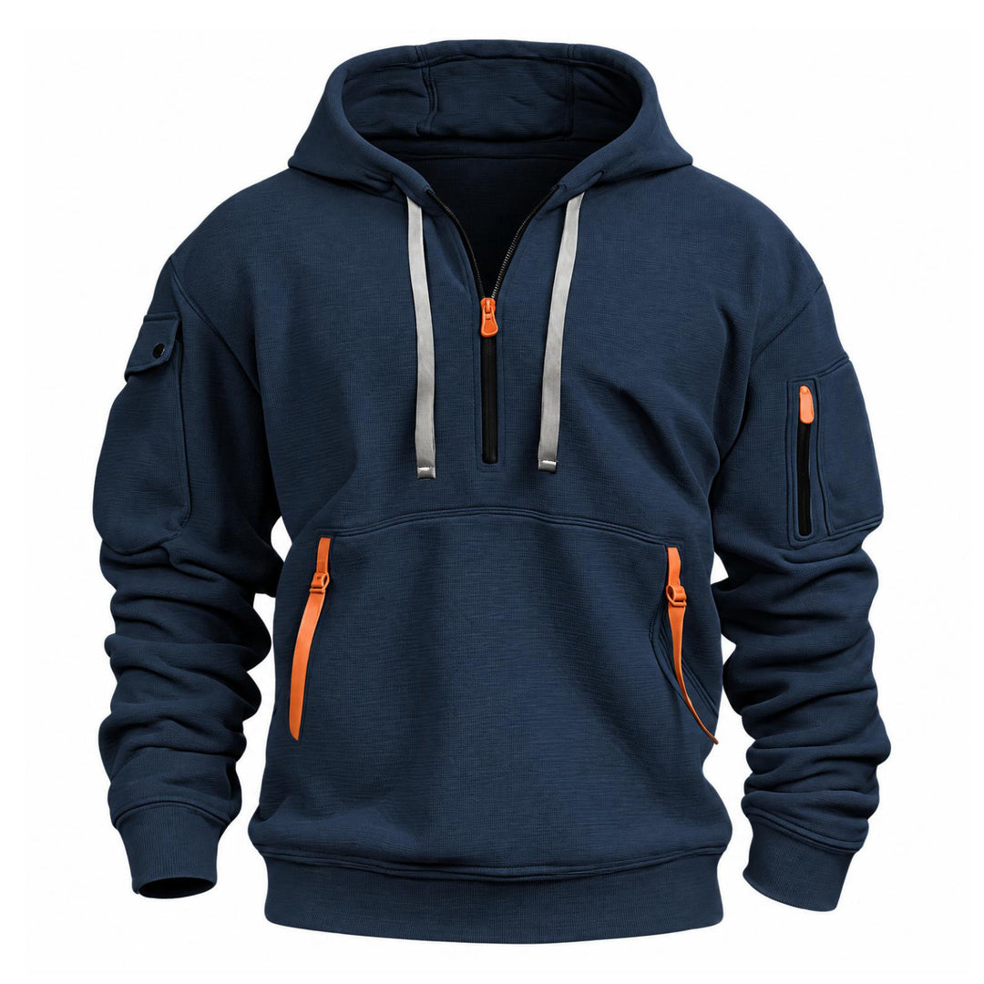 Marineblauwe hoodie van voren met halve rits, oranje ritstrekkers en mouwzakken op witte achtergrond 2