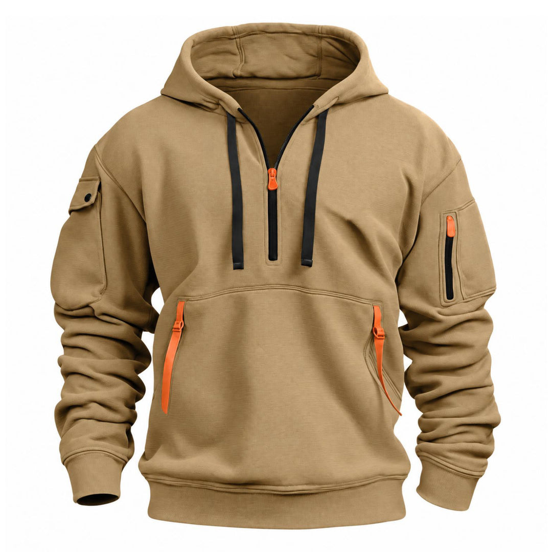 Zandkleurige hoodie van voren met zwarte trekkoorden, oranje ritsen en zak op de mouw 4