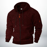Dezelfde hoodie in gemêleerd bordeauxrood, voorkant met capuchon, doorlopende rits, zakken en ritszakje op de mouw. 2