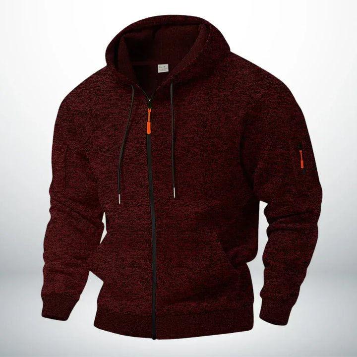 Dezelfde hoodie in gemêleerd bordeauxrood, voorkant met capuchon, doorlopende rits, zakken en ritszakje op de mouw. 2