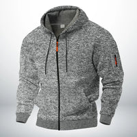 Dezelfde hoodie in gemêleerd lichtgrijs, voorkant met capuchon, trekkoord, oranje ritstrekker en ritszakje op de mouw. 3