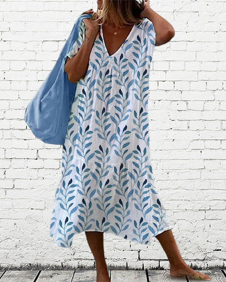 Trendy midi jurk met bladerenpatroon en V-hals – Nea