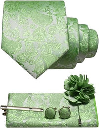 Paisleyset in lichtgroen met zilverachtige tint: opgerolde das, pochet, manchetknopen, dasspeld en bloemvormige reversspeld. 22