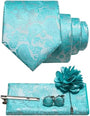 Paisleyset in aquablauw of mintturquoise: das, pochet, manchetknopen, dasspeld en een bloemvormige reversspeld. 34