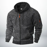 Dezelfde hoodie in gemêleerd donkergrijs, voorkant met capuchon, trekkoord, ribboorden en ritszakje op de mouw. 5