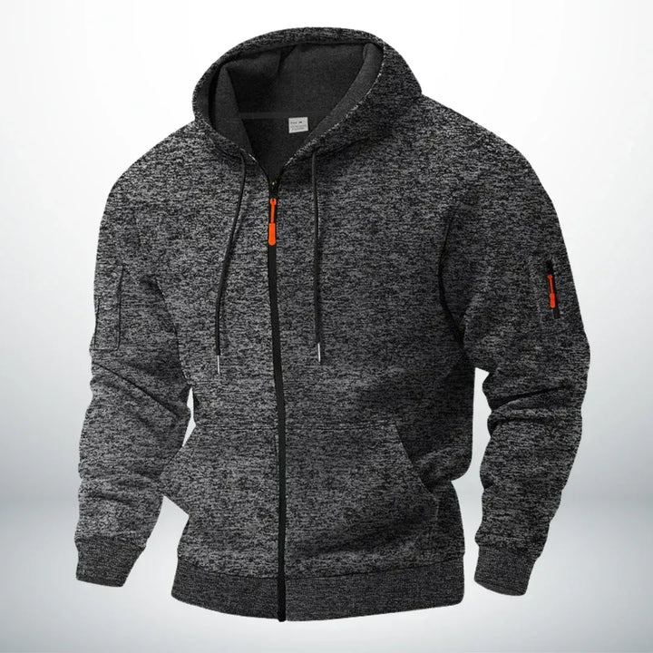 Dezelfde hoodie in gemêleerd donkergrijs, voorkant met capuchon, trekkoord, ribboorden en ritszakje op de mouw. 5