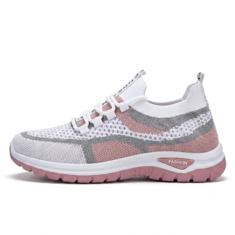 Zijaanzicht van de witte gaas sneaker met roze zool en grijze accenten, met elastische veters. 19
