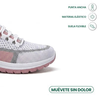 Neus van de witte gaas sneaker met roze en grijze accenten, met pictogrammen voor brede neus, elastisch materiaal en flexibele zool. 23