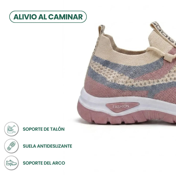 Achterkant en hiel van de beige sneaker met roze en blauwgrijs gaas, met pictogrammen voor hielsteun, antislipzool en voetboogsteun. 31
