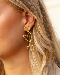 Double heart pendant earrings