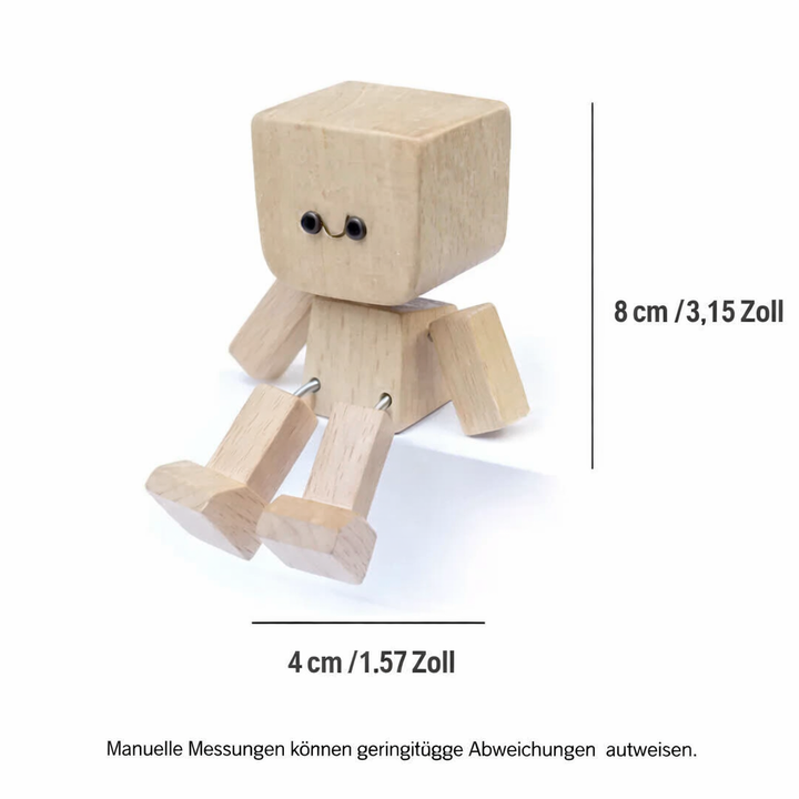 Houten figuurtje op wit vlak met maatlijnen voor hoogte en breedte, benen met metalen veertjes aan het lichaam bevestigd. 8