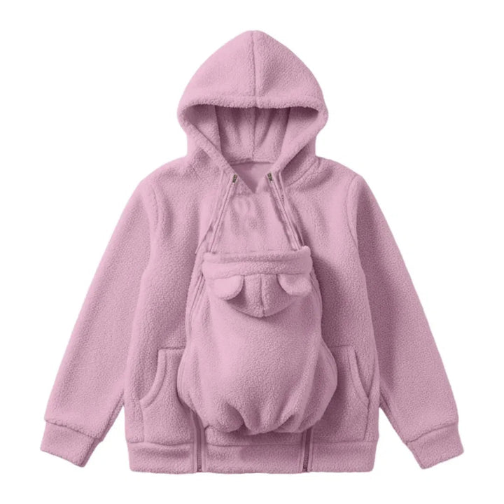 Roze sherpa-fleecehoodie plat gelegd met het afneembare babypaneel met beren-oortjes in het midden van de voorkant. 1