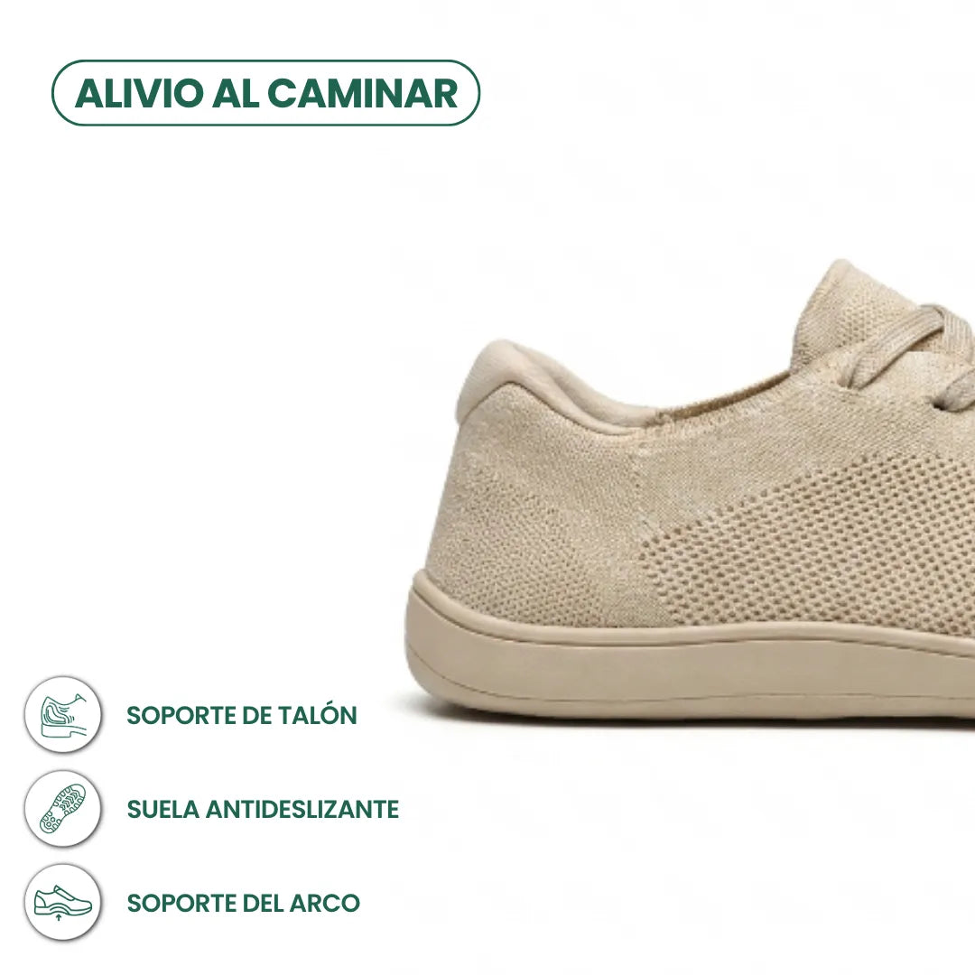 Detail van de hiel van de beige sneaker met pictogrammen voor hielondersteuning, antislipzool en ondersteuning van de voetboog. 4