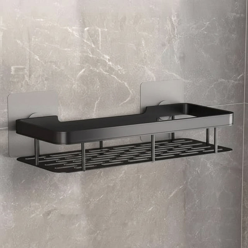 Lege zwarte plank met gaatjesbodem, bevestigd met twee zelfklevende platen op een marmerlook wand 14