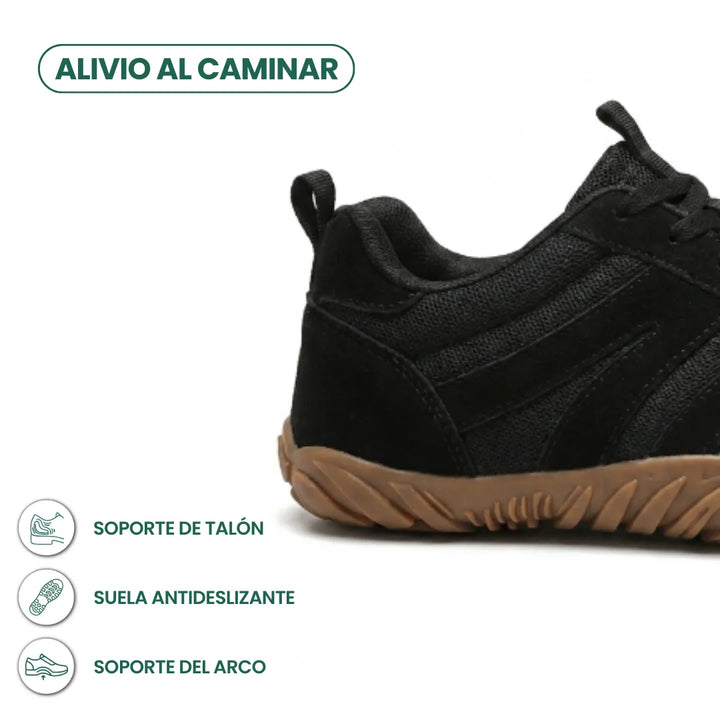 Zijaanzicht van de hiel van een zwarte barefoot sneaker van gaas en suède met bruine zool, met pictogrammen. 22