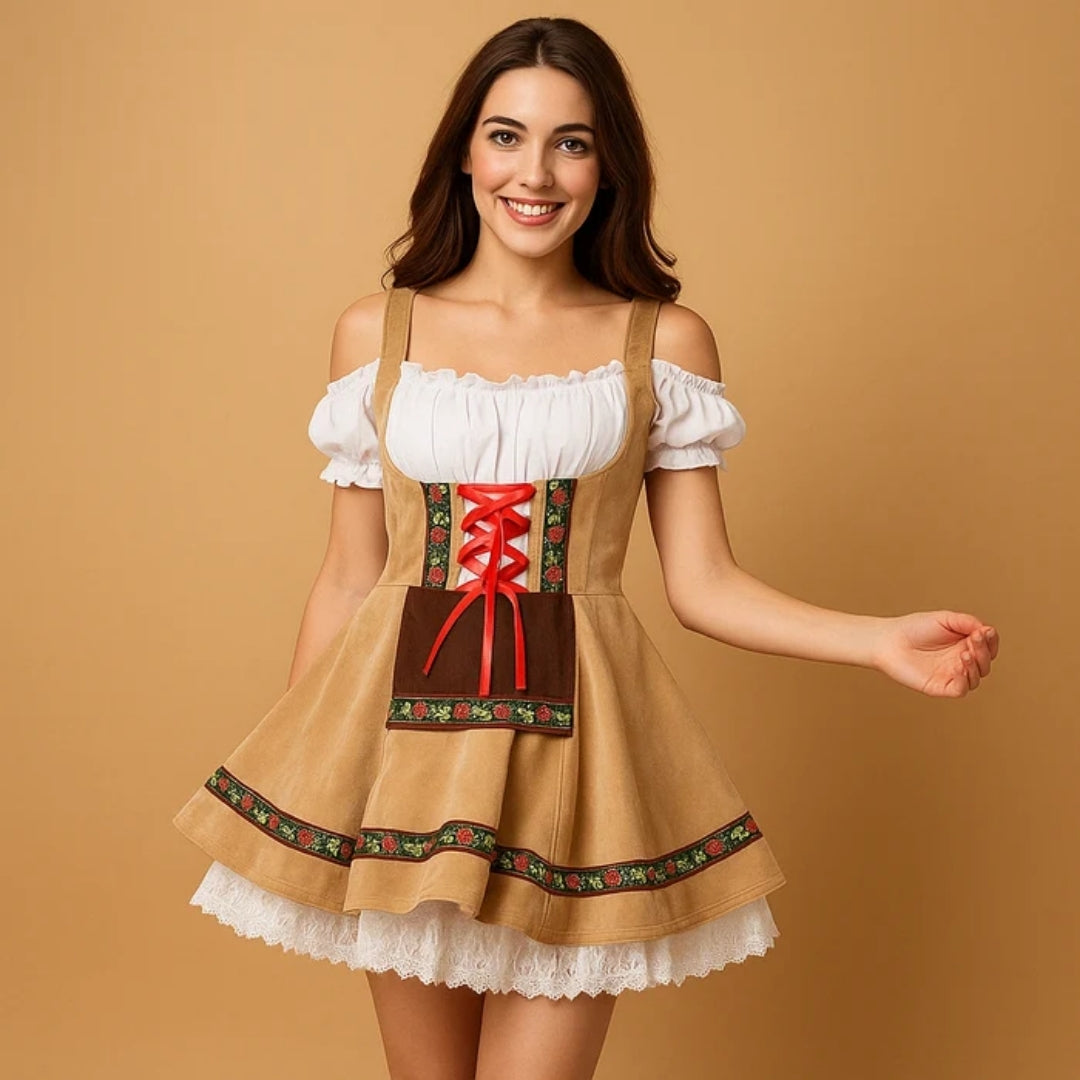Lachend model draagt een beige dirndl met bruin schortje, rode veters, bloemenband en een witte kanten onderrok. 3