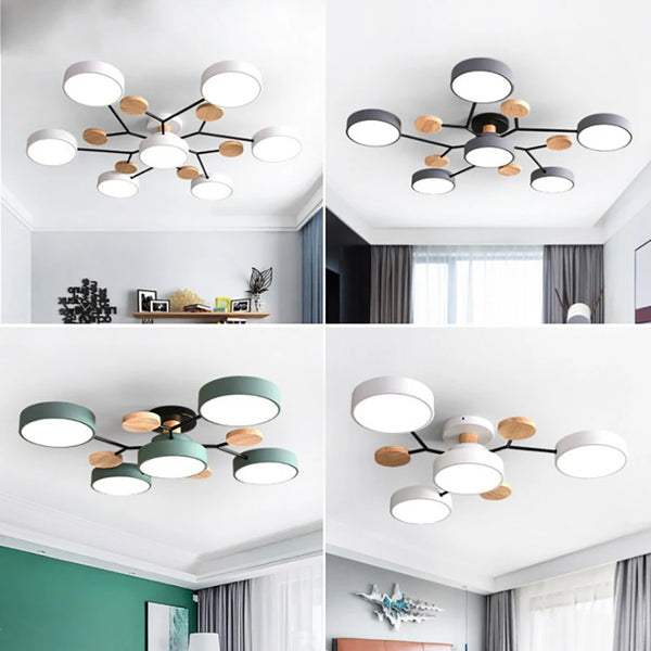 Collage van vier plafondlampen met ronde lampenkappen en houten schijfjes aan zwarte armen, in wit, grijs, groen en wit, elk in een eigen kamer. 1