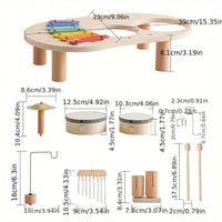 Overzicht van alle losse onderdelen van de muziektafel, zoals tafelblad met poten, trommels, bekken, windgong en stokjes, met afmetingen in centimeters. 3
