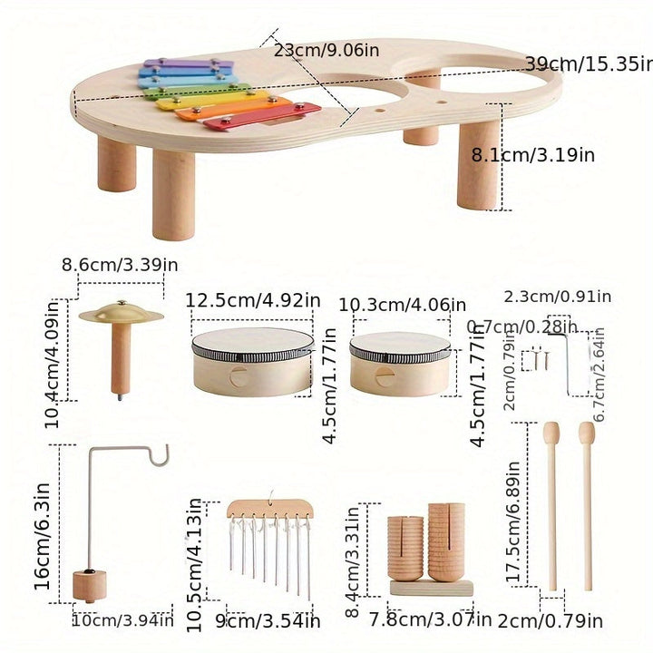Overzicht van alle losse onderdelen van de muziektafel, zoals tafelblad met poten, trommels, bekken, windgong en stokjes, met afmetingen in centimeters. 3