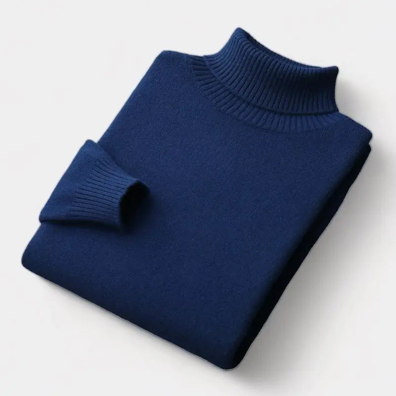Opgevouwen donkerblauwe coltrui met geribbelde kraag en manchet in een flatlay 7