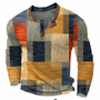 Voorkant van de trui met knoopsluiting in oranje, geel, blauw en beige blokken met strepen en een bruine kraagrand. 1
