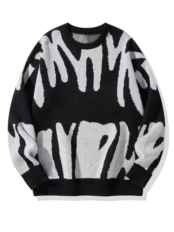 Zwarte gebreide sweater met wit abstract patroon, plat van voren gefotografeerd 2
