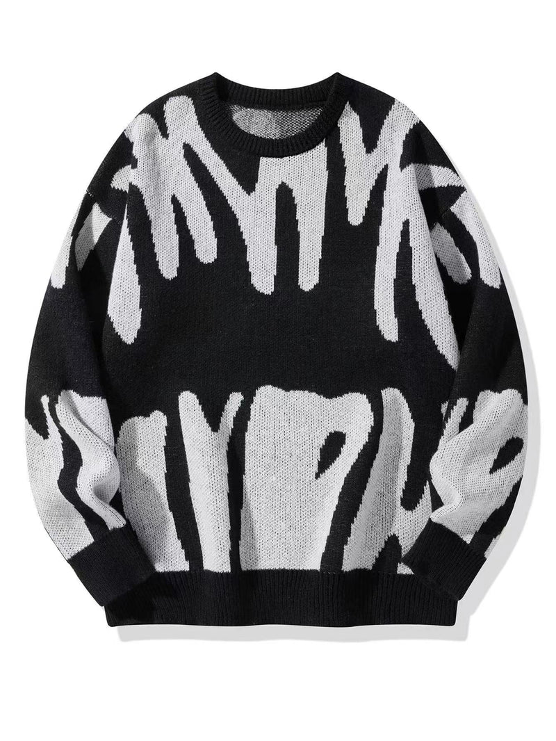 Zwarte gebreide sweater met wit abstract patroon, plat van voren gefotografeerd 2