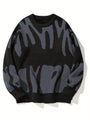 Zwarte gebreide sweater met grijs abstract patroon, plat van voren gefotografeerd 4