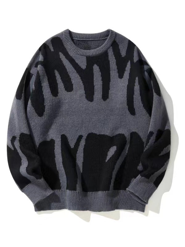 Grijze gebreide sweater met zwart abstract patroon, plat van voren gefotografeerd 1