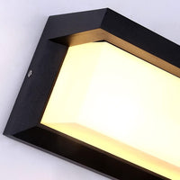 Close-up van de hoek van het zwarte frame met de melkwitte lichtkap en een schroef 2