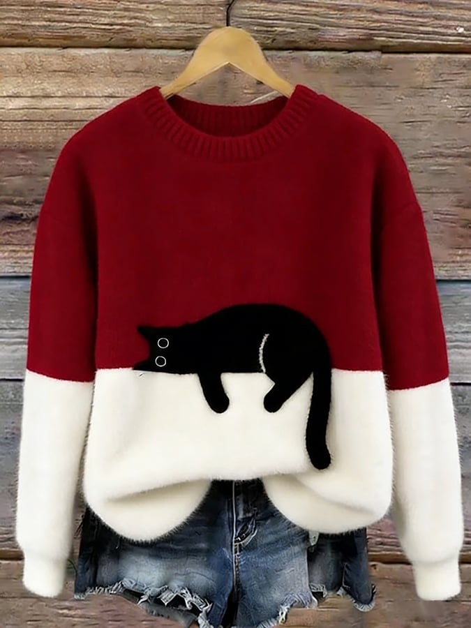 Trui in rood en wit met zwarte kat op de witte onderkant, aan een hanger 6