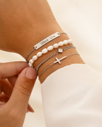 Gouden en zilveren kruis armband