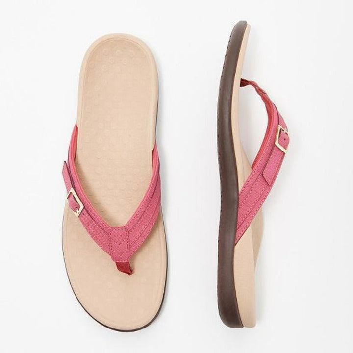Roze teensandalen met gesp, bovenaanzicht van de beige voetbedding en zijaanzicht van de zool 6