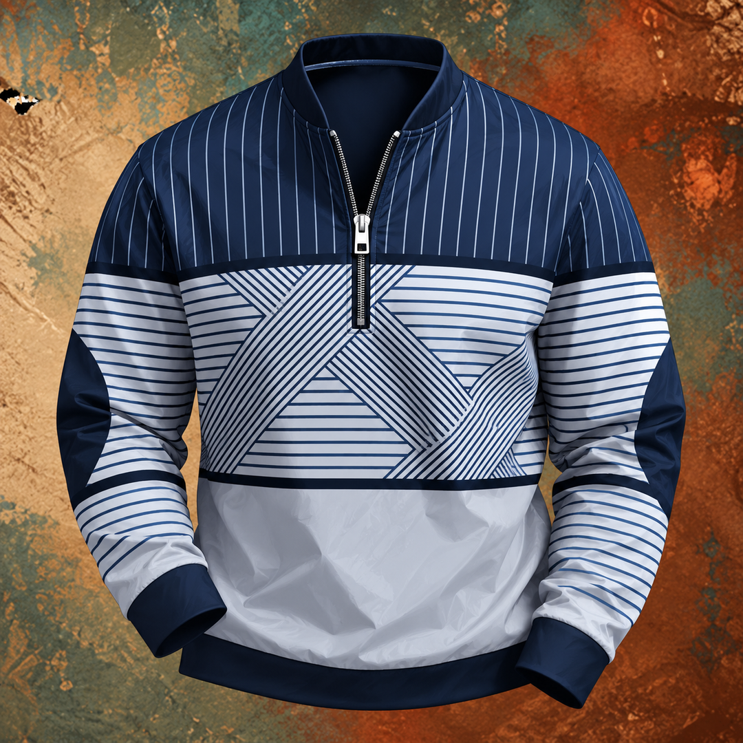 Voorkant van de pullover in marineblauw en wit met verticale en horizontale strepen, geometrisch patroon en halve rits, tegen een roestkleurige achtergrond. 2