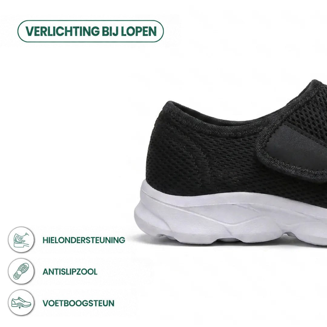 Zwarte mesh wandelschoen met witte zool en klittenband, detail van de hiel met pictogrammen voor hielsteun, antislipzool en voetboogsteun. 22