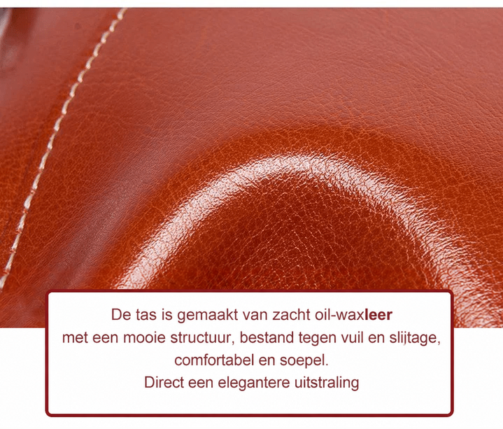 Close-up van de glanzende structuur van het zachte roodbruine oliewaxleer met stiksels 14