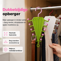 Groen en wit paraplurek met roze en rode bolletjes in een kast, behangen met riemen en dassen 1