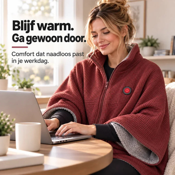 Vrouw werkt op een laptop aan tafel terwijl ze de rode cape draagt 11
