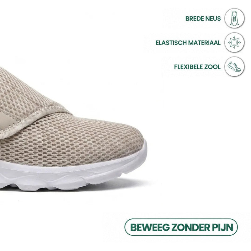 Close-up van de brede neus van de beige mesh schoen met witte flexibele zool en pictogrammen voor elastisch materiaal. 32