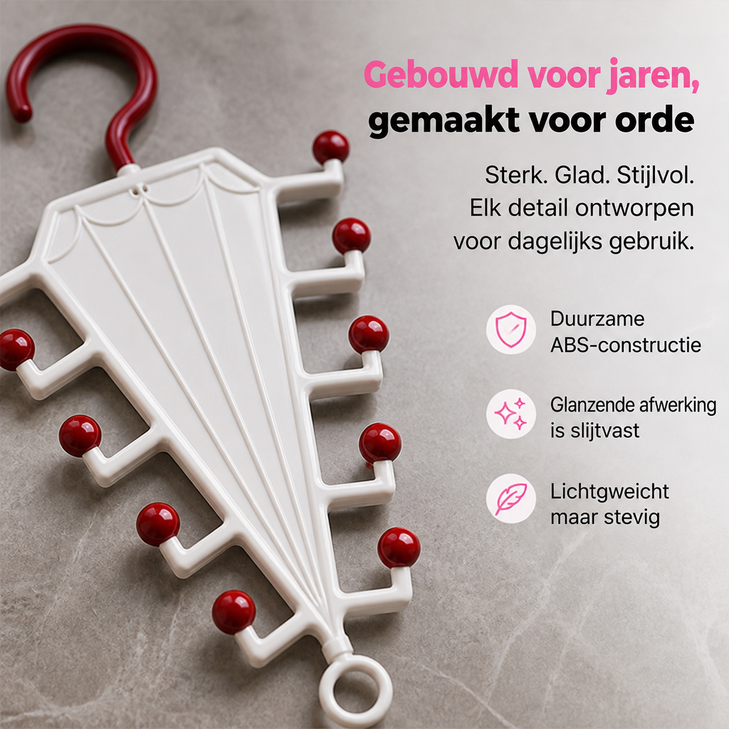Wit paraplurek met rode bolletjes en rode haak, close-up liggend op een grijze steen-achtige ondergrond 3