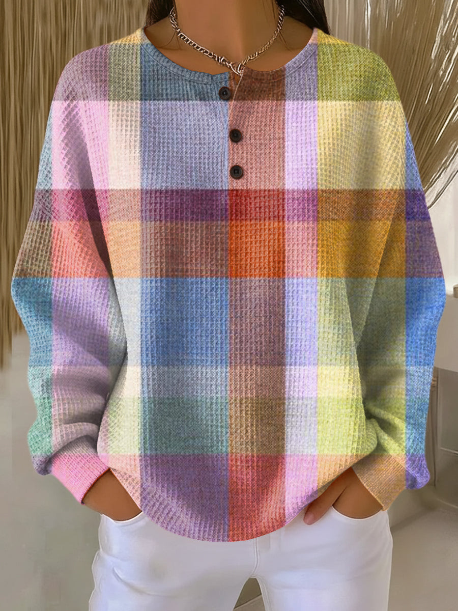 Wafeltrui met knoopjes en groot geruit patroon in pastelkleuren roze, blauw, paars, geel en oranje. 9