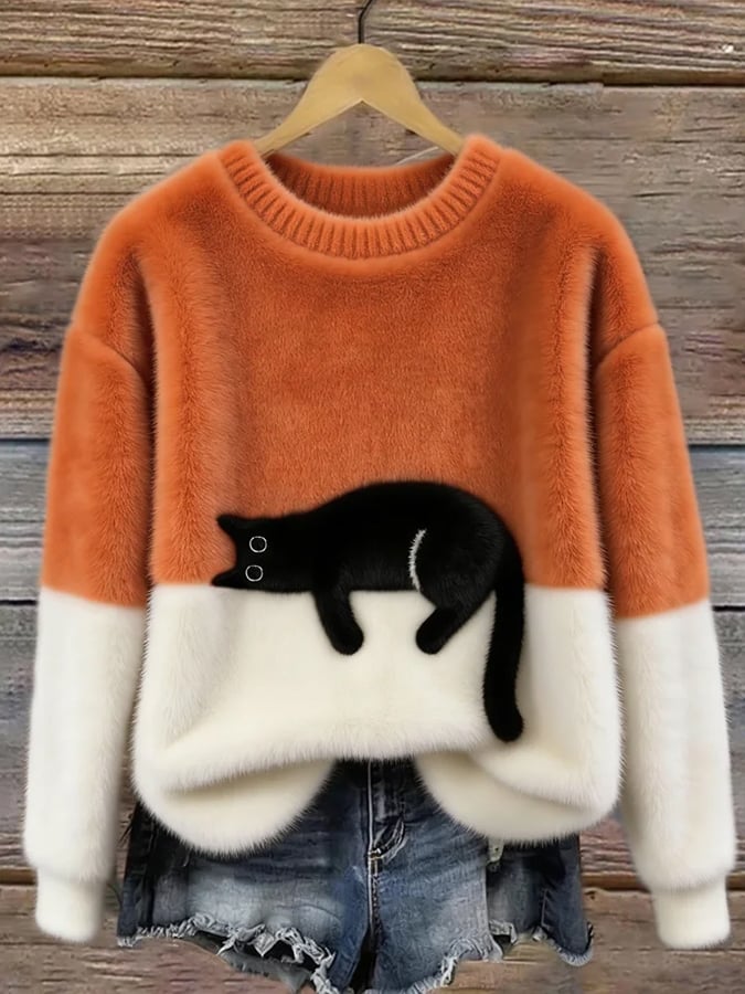 Pluche trui in oranje en wit met zwarte kat op de kleurnaad, aan een hanger 3