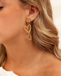 Double heart pendant earrings