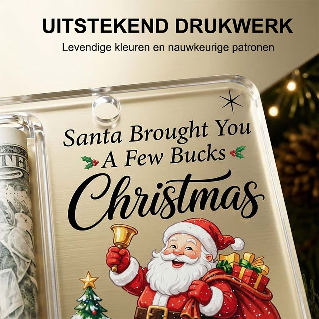 Close-up van de bedrukte voorkant met kerstman, belletje en tekst, naast het buisje met opgerold biljet. 4