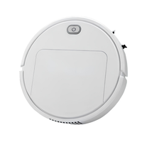 Witte ronde robotstofzuiger van bovenaf, met aan/uit-knop en een rechthoekig klepje op het deksel, tegen een witte achtergrond. 1