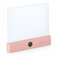 Roze staande lamp met lichtgevend paneel en bedieningsknoppen, schuin van voren gezien 16