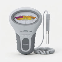 Productfoto van de tester op een lichtgrijze achtergrond, met wijzerplaat, schakelaar en sonde aan een opgerolde spiraalkabel. 7